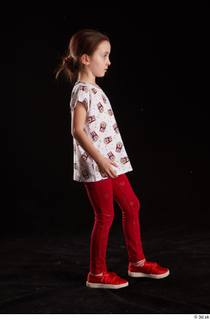 Lilly  1 dressed red leggings red shoes side view…